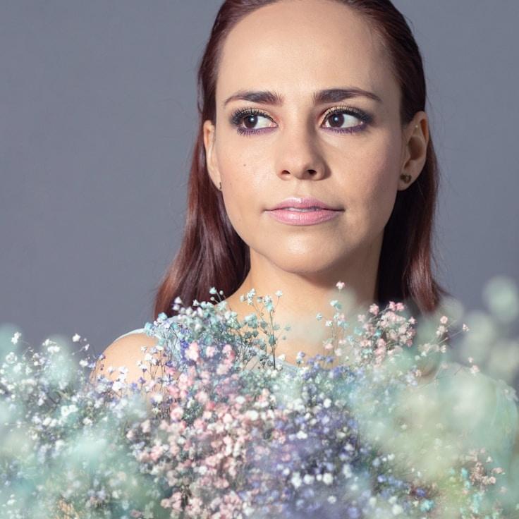 Kaveri Mehta, Lead Design Curator at Evening Compass Sphere, reviewing corporate floral arrangements